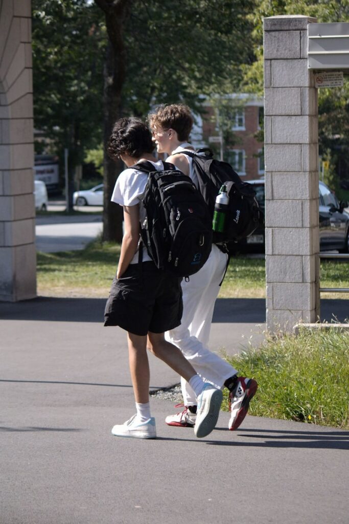 A couple of people that are walking down the street